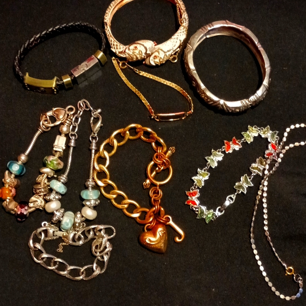 Many different styles and makes silver and gold bracelets
